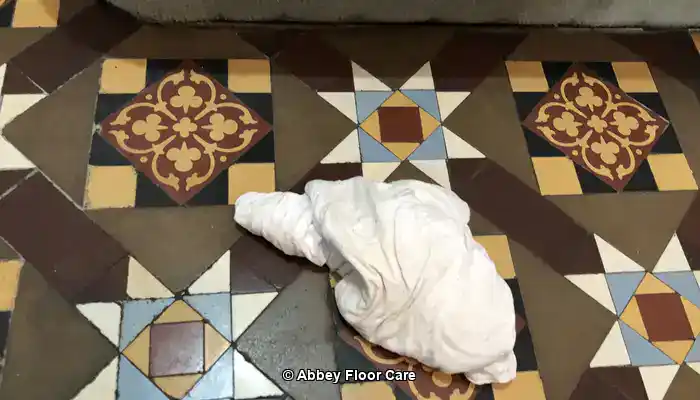 Abbey Floor Care restoring the colour to a Victorian clay tile floor using a colour-enhancing impregnating sealer