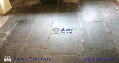 paint cement lime residue and lost grout on an old slate floor in Corris